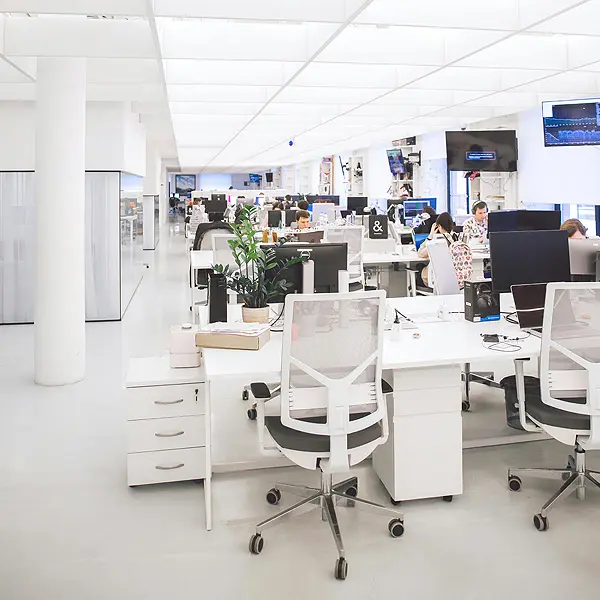 Modern office interior in the UK with desks, chairs, and workspaces